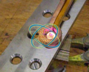 Heating steel rivets Heating steel rivets