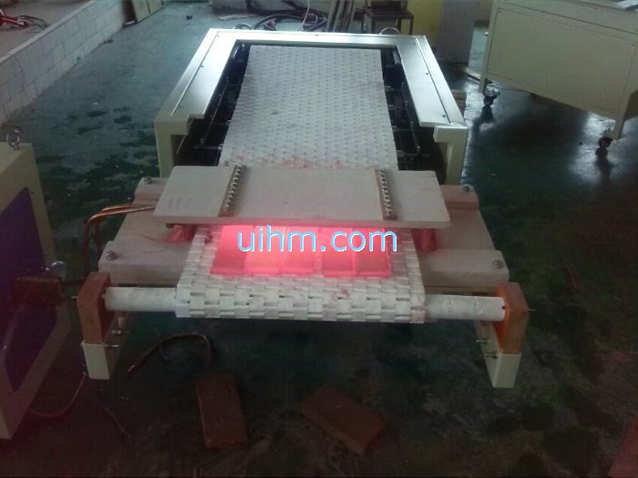 induction heating steel plates by auto feed system with 120KW induction heater induction heating steel plates by auto feed system with 120KW induction heater